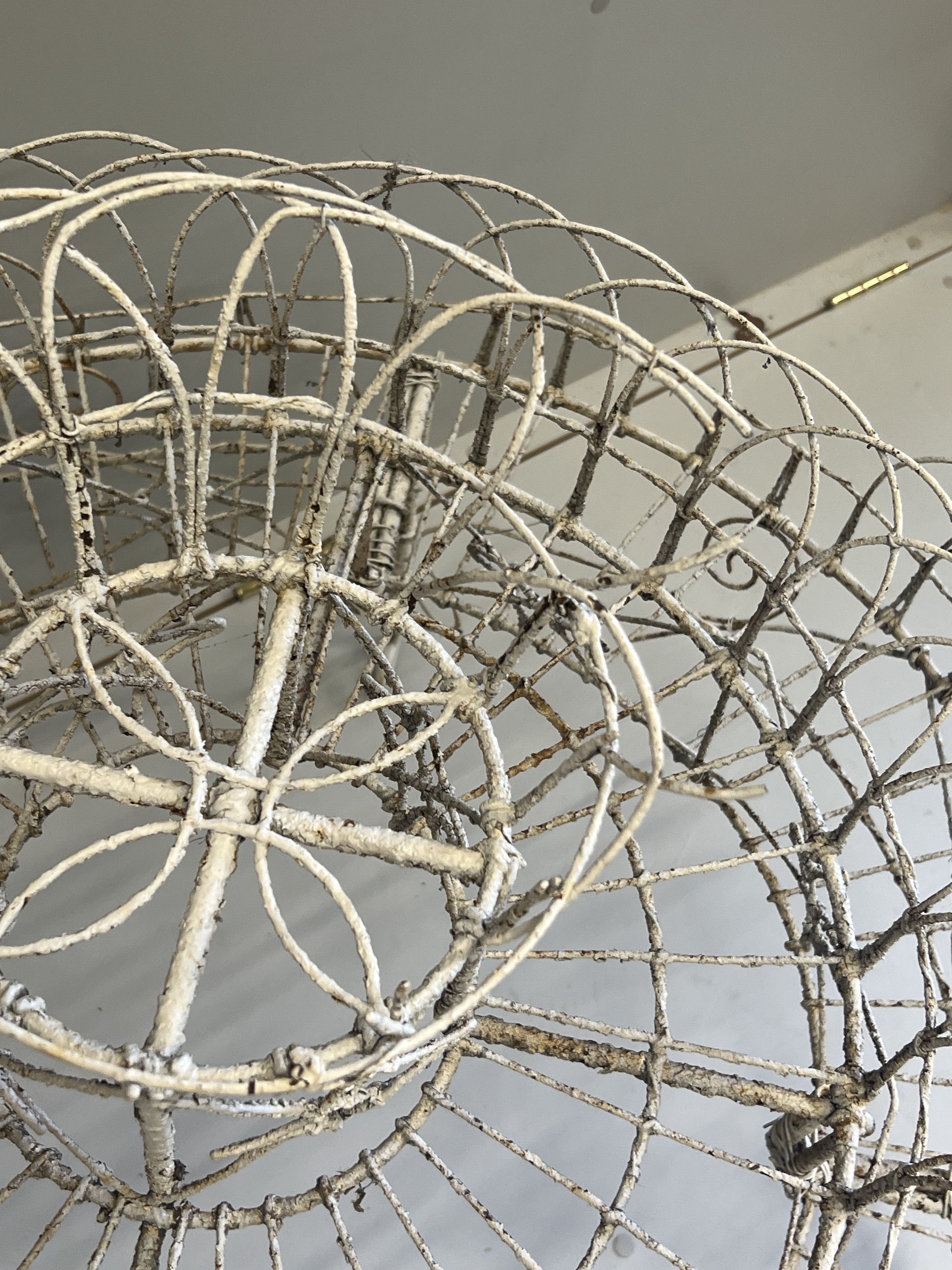 A Victorian painted wirework circular three tier pot stand, diameter 94cm, height 81cm